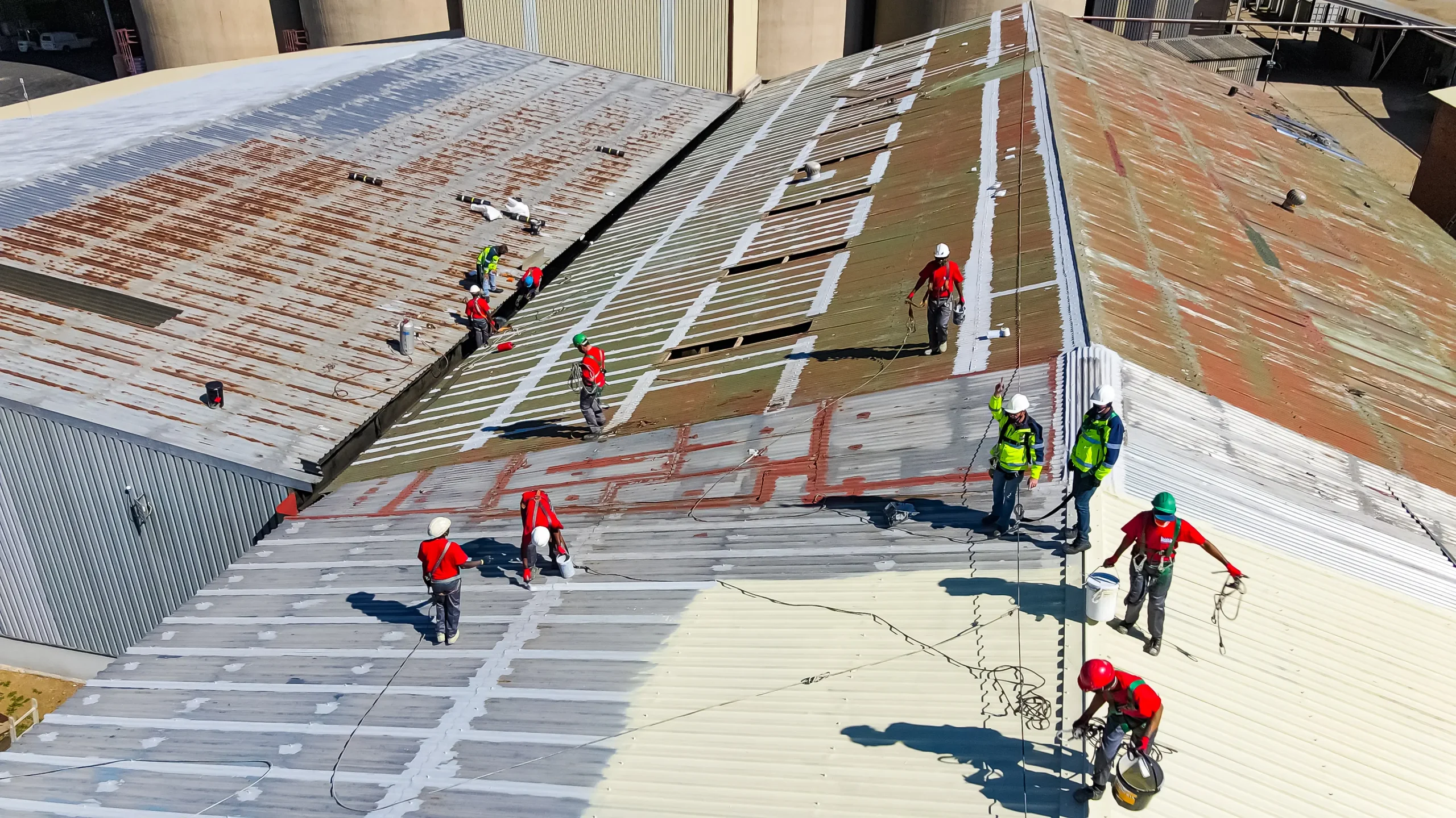 Roof repair specialists working on commercial building in Gauteng
